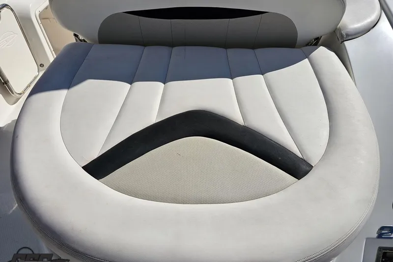Slide: The Image of 2010 Chaparral 276 SSX boat seat with white and black upholstery. - 35