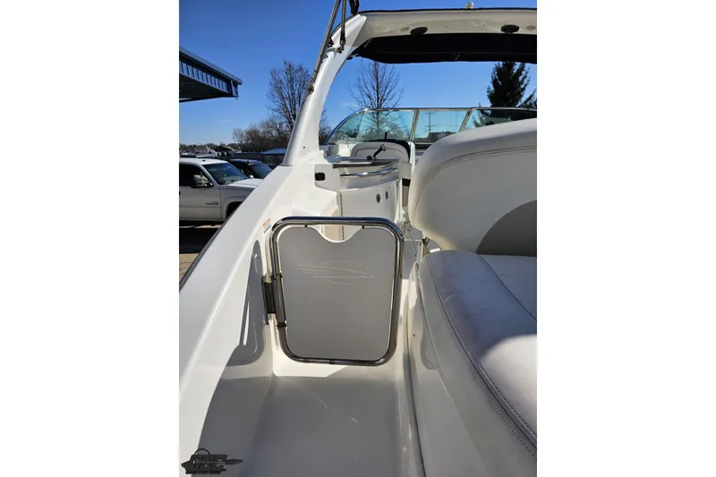 Slide: The Image of 2010 Chaparral 276 SSX boat interior with white seating and stainless steel accents. - 37
