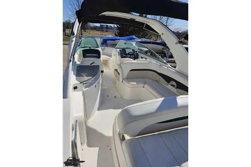 Slide: The Image of 2010 Chaparral 276 SSX boat interior with white seating and sleek design. - 38
