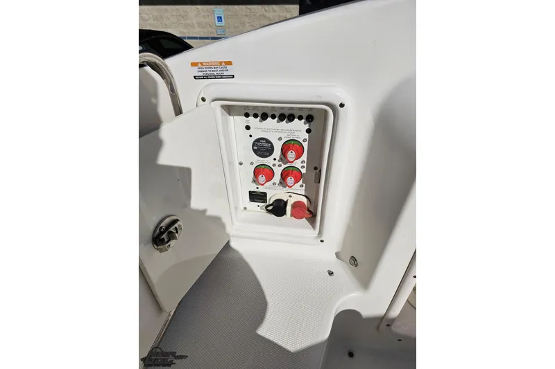Slide: The Image of Control panel of a 2010 Chaparral 276 SSX boat, featuring switches and dials. - 50