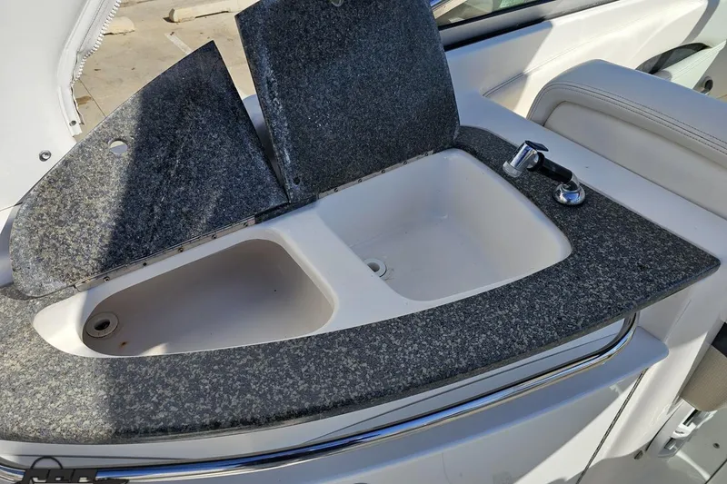 Slide: The Image of 2010 Chaparral 276 SSX boat sink with granite countertop and faucet. - 52
