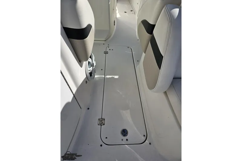 Slide: The Image of Interior view of 2010 Chaparral 276 SSX boat, featuring seating and storage compartment. - 54