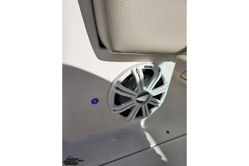 Slide: The Image of Speaker system in 2010 Chaparral 276 SSX boat interior, featuring a Kicker audio component. - 57