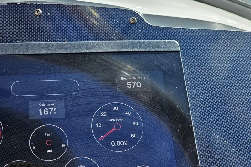 Slide: The Image of Dashboard of a 2010 Chaparral 276 SSX showing 570 engine hours and 167 feet odometer. - 70