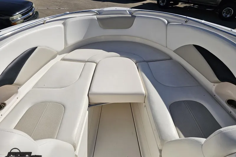 Slide: The Image of Interior view of 2010 Chaparral 276 SSX boat with white cushioned seating. - 79