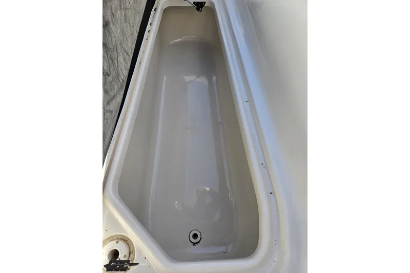 Slide: The Image of Storage compartment of a 2010 Chaparral 276 SSX boat, clean and empty. - 83