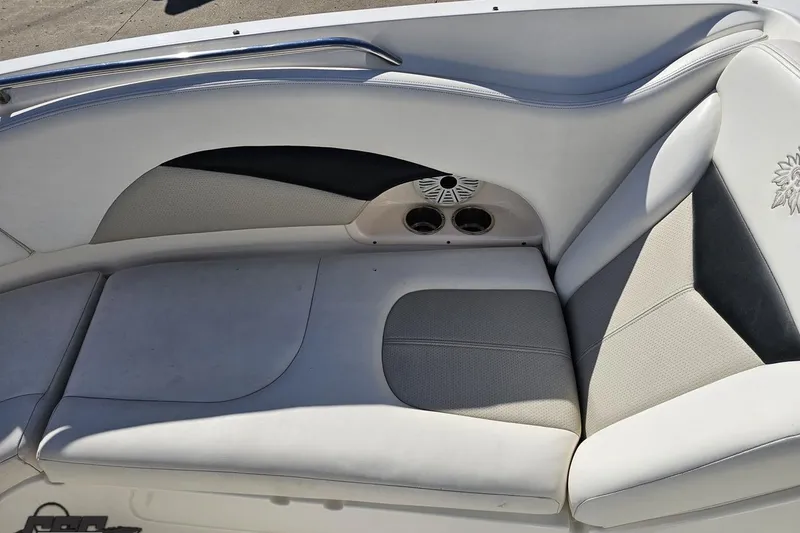 Slide: The Image of 2010 Chaparral 276 SSX boat interior seating with speaker and cup holders. - 84
