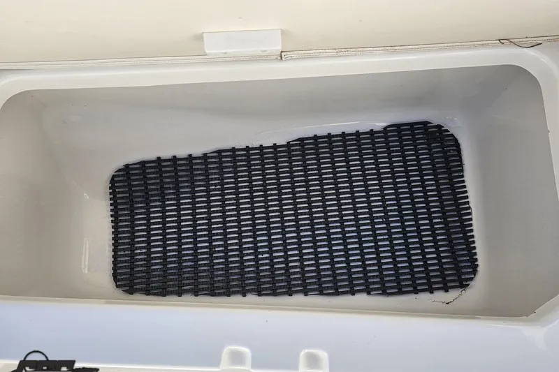 Slide: The Image of Storage compartment with black mat in 2010 Chaparral 276 SSX boat. - 87