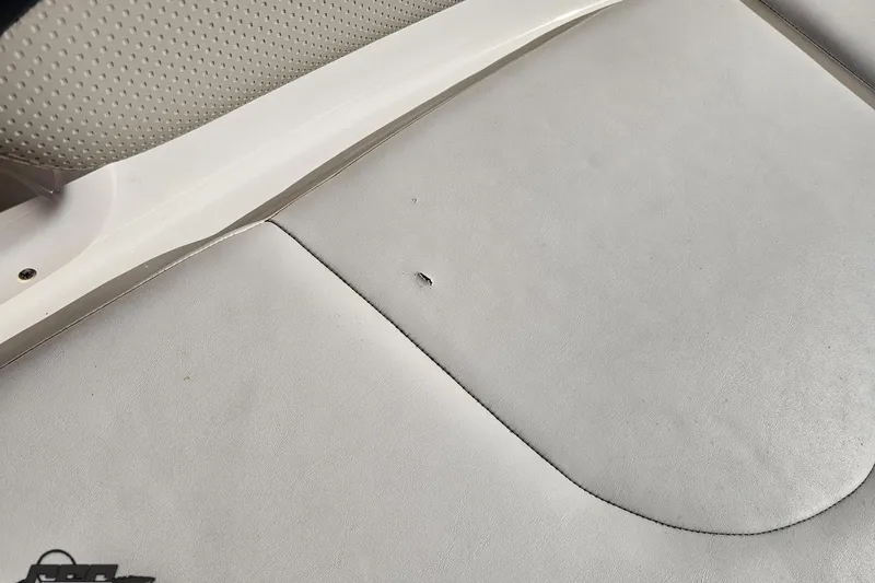 Slide: The Image of 2010 Chaparral 276 SSX boat seat with small tear in upholstery. - 89