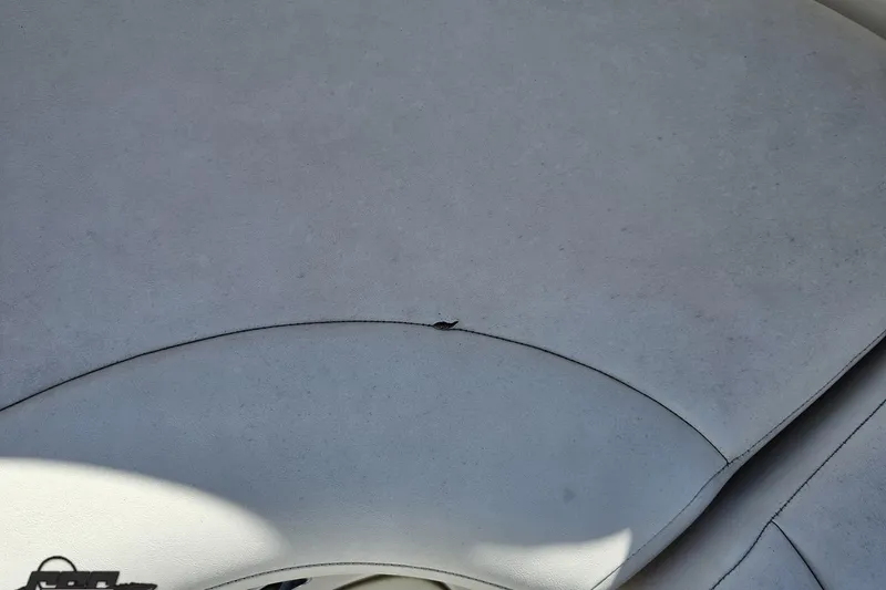 Slide: The Image of 2010 Chaparral 276 SSX boat upholstery with visible seam and minor wear. - 92