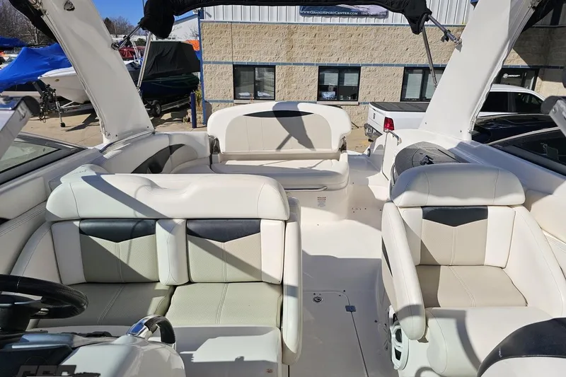 Slide: The Image of 2010 Chaparral 276 SSX boat interior with white seating and modern design. - 98