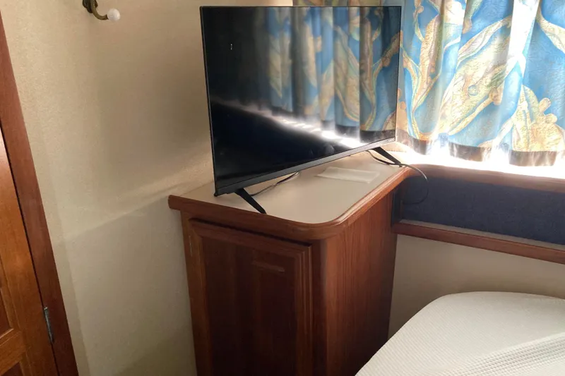 Slide: The Image of Flat-screen TV on wooden cabinet in 1989 Knight & Carver 3807 interior. - 24