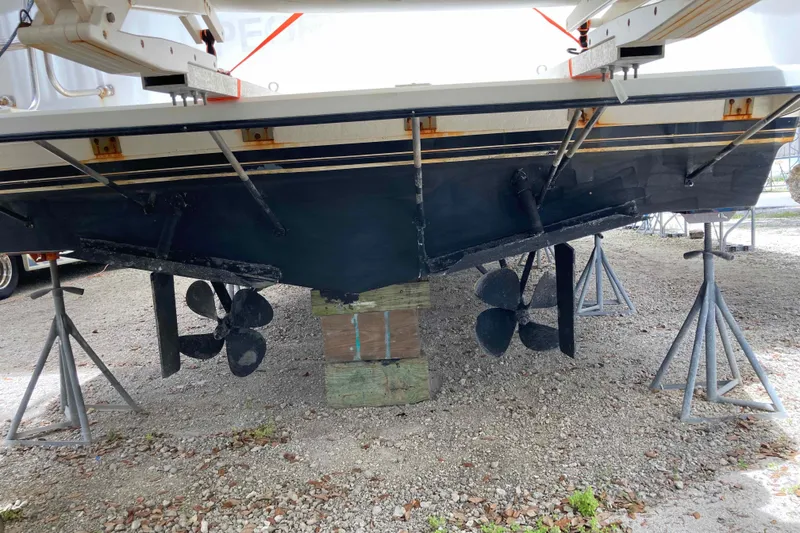 Slide: The Image of 1989 Knight & Carver 3807 yacht on stands, showing dual propellers and rudders. - 32