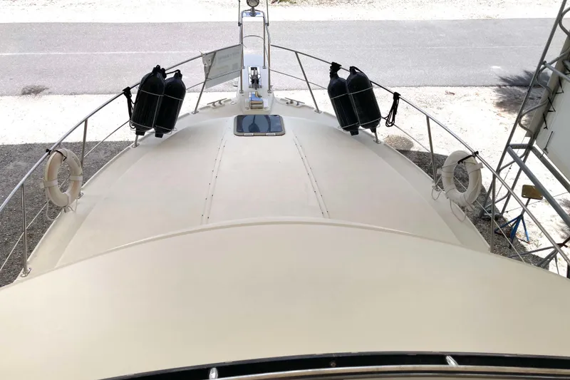 Slide: The Image of Bow view of 1989 Knight & Carver 3807 yacht with life rings and tanks. - 4