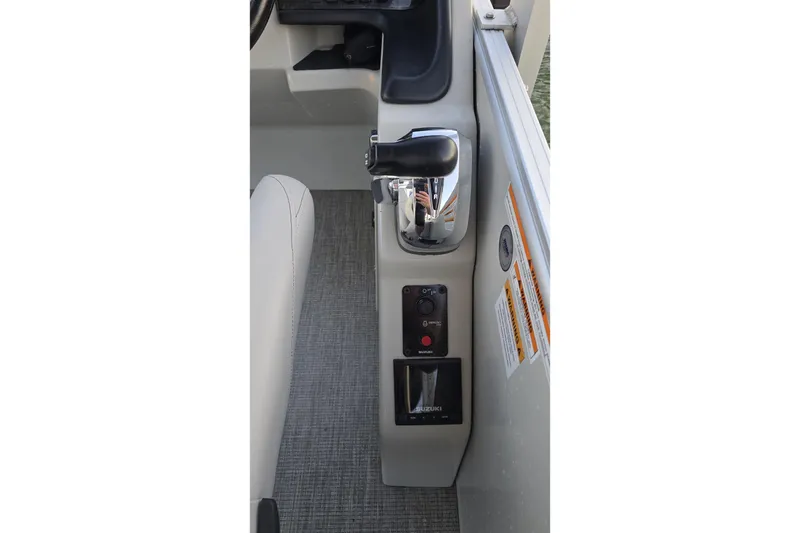 Slide: The Image of Control panel of 2023 Avalon Catalina 2585 CRFS Funship boat, featuring throttle and switches. - 10