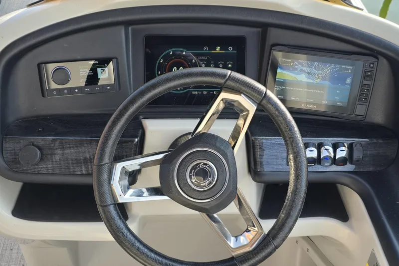 Slide: The Image of Steering console of 2023 Avalon Catalina 2585 CRFS Funship with modern controls and displays. - 8