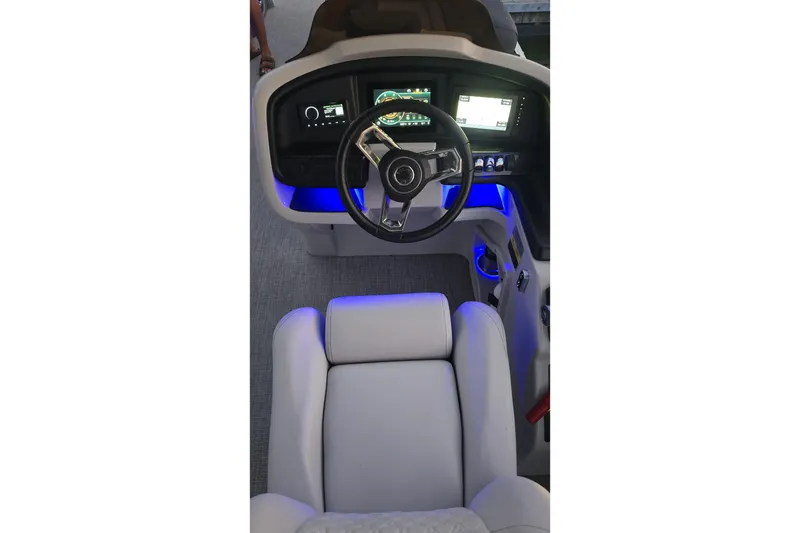 Slide: The Image of Cockpit of 2023 Avalon Catalina 2585 CRFS Funship with illuminated dashboard and steering wheel. - 9