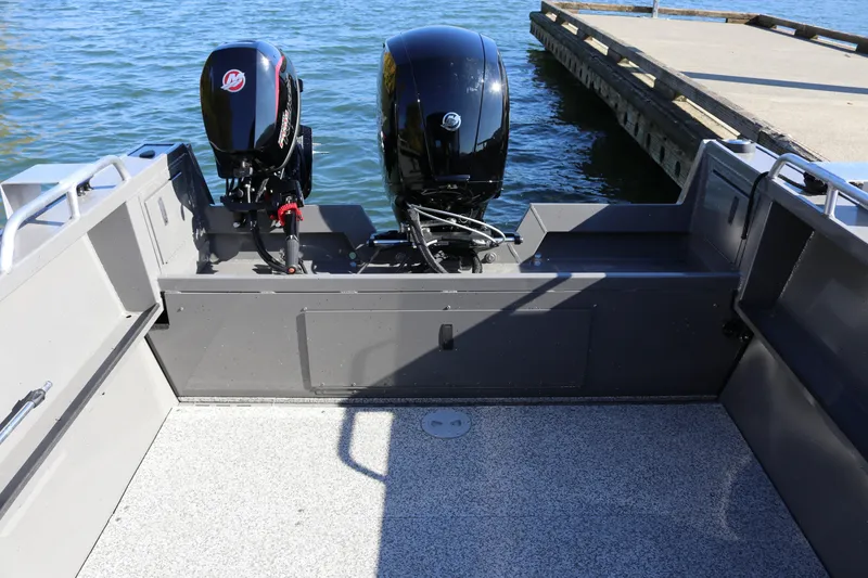 Slide: The Image of 2026 Alumaweld Stryker 220 boat with dual outboard motors at dock. - 13