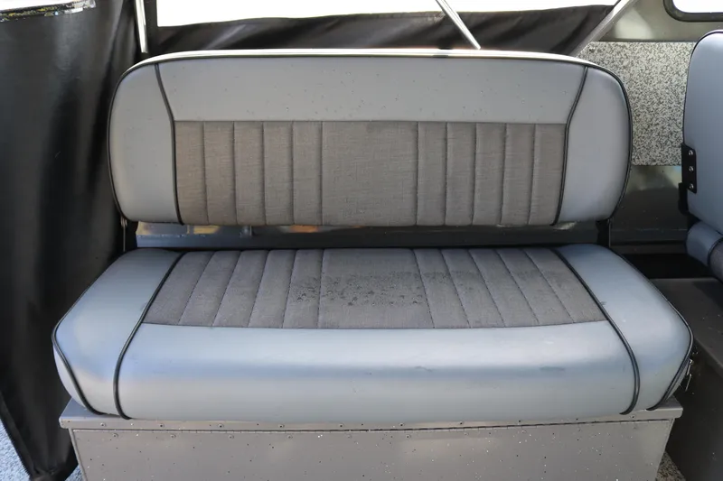 Slide: The Image of Gray cushioned seat in 2026 Alumaweld Stryker 220 boat interior. - 14