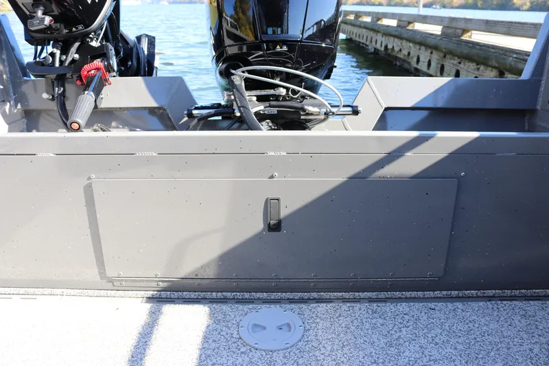 Slide: The Image of 2026 Alumaweld Stryker 220 boat stern view with dual outboard motors at dock. - 15