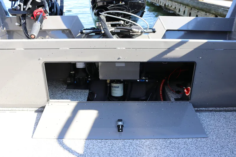 Slide: The Image of 2026 Alumaweld Stryker 220 boat engine compartment with open access panel. - 16