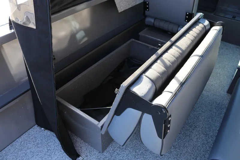 Slide: The Image of 2026 Alumaweld Stryker 220 boat interior storage compartment with foldable seat. - 22
