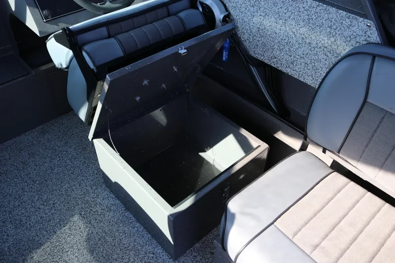 Slide: The Image of 2026 Alumaweld Stryker 220 boat interior with open storage compartment and seating. - 24