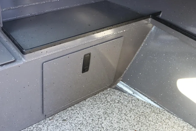 Slide: The Image of 2026 Alumaweld Stryker 220 boat interior storage compartment with speckled finish. - 30