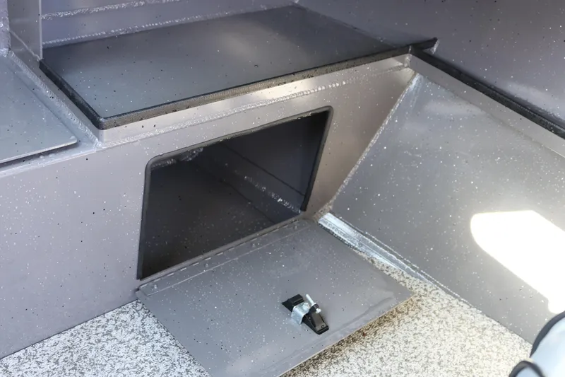 Slide: The Image of 2026 Alumaweld Stryker 220 boat storage compartment with open hatch and latch. - 31