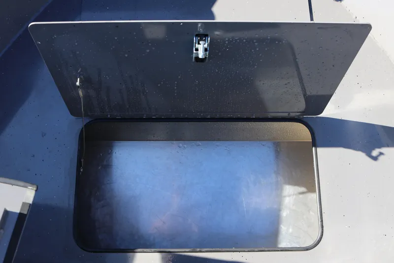 Slide: The Image of Open storage compartment on 2026 Alumaweld Stryker 220 boat, showcasing interior space. - 36