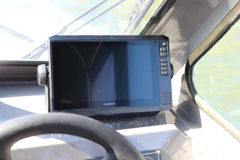 Slide: The Image of Garmin navigation system on 2026 Alumaweld Stryker 220 boat dashboard. - 8