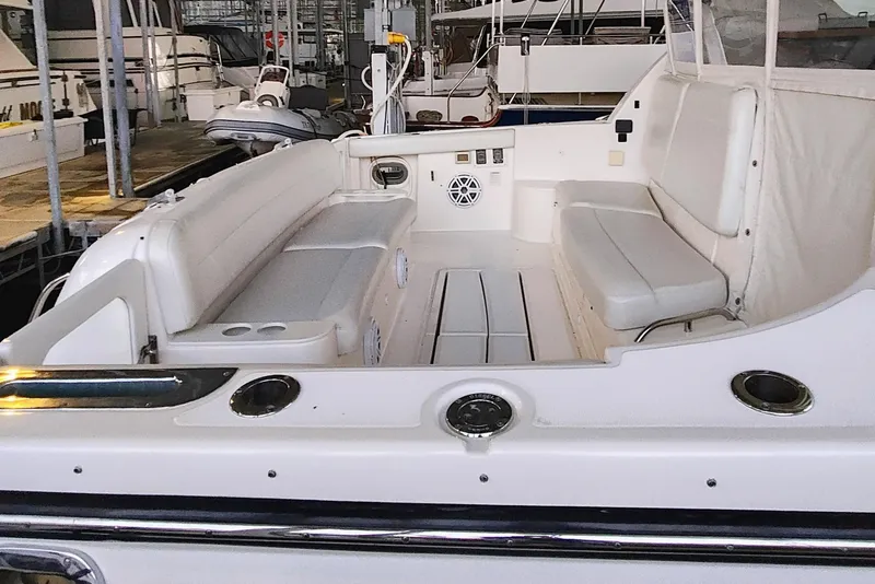 Slide: The Image of 2004 Tiara Yachts 4400 Sovran in a covered marina. - 3