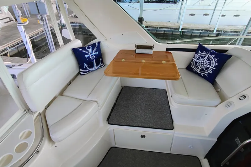 Slide: The Image of 2004 Tiara Yachts 4400 Sovran docked under covered marina. - 4