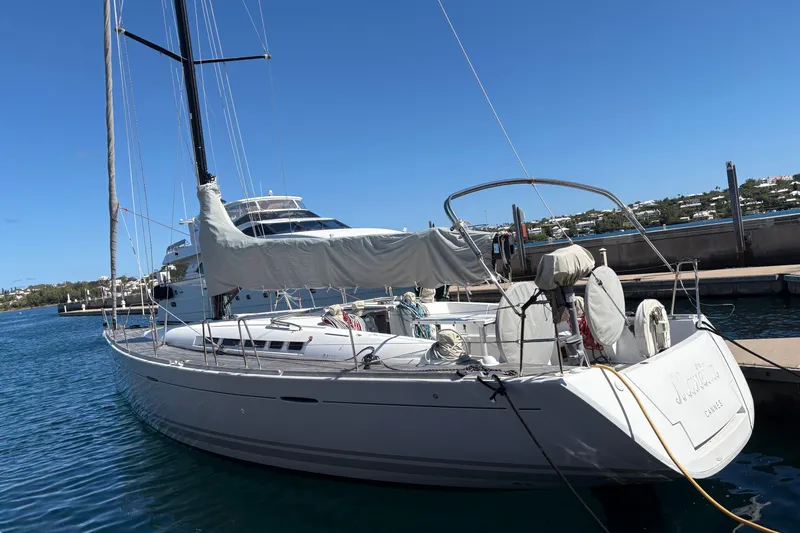 The Image of 2008 Beneteau First 50 sailboat docked in a sunny marina, showcasing sleek design. - 0