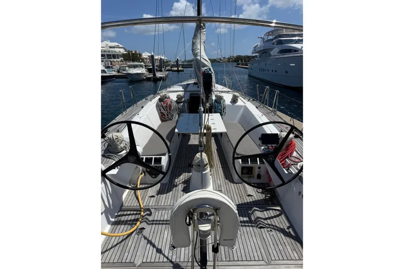 Slide: The Image of 2008 Beneteau First 50 sailboat cockpit with dual steering wheels in marina. - 11