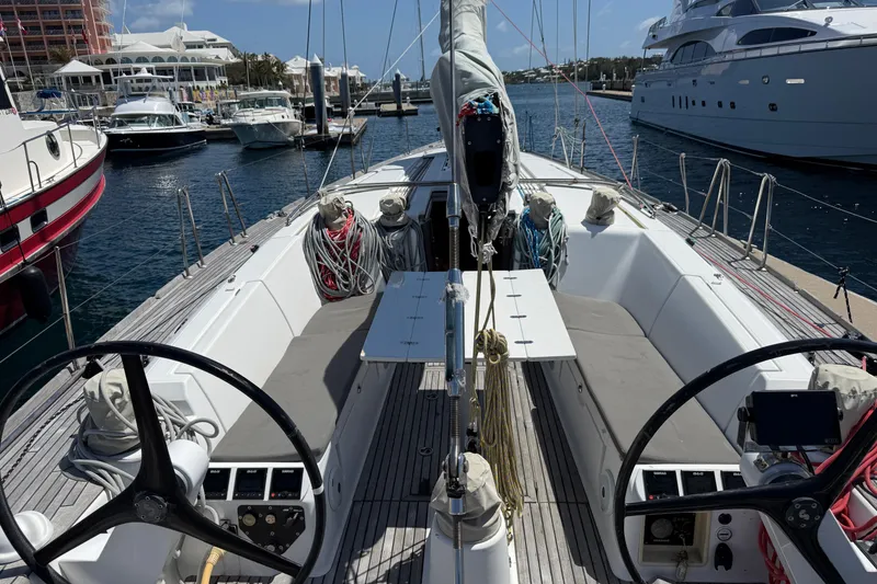 Slide: The Image of Cockpit view of a 2008 Beneteau First 50 sailboat docked at a marina. - 12