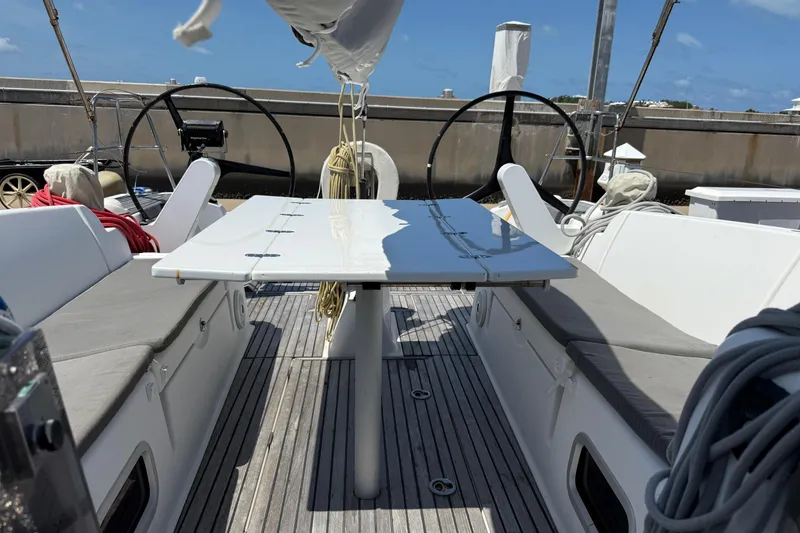 Slide: The Image of Cockpit of 2008 Beneteau First 50 sailboat with dual steering wheels and seating area. - 13