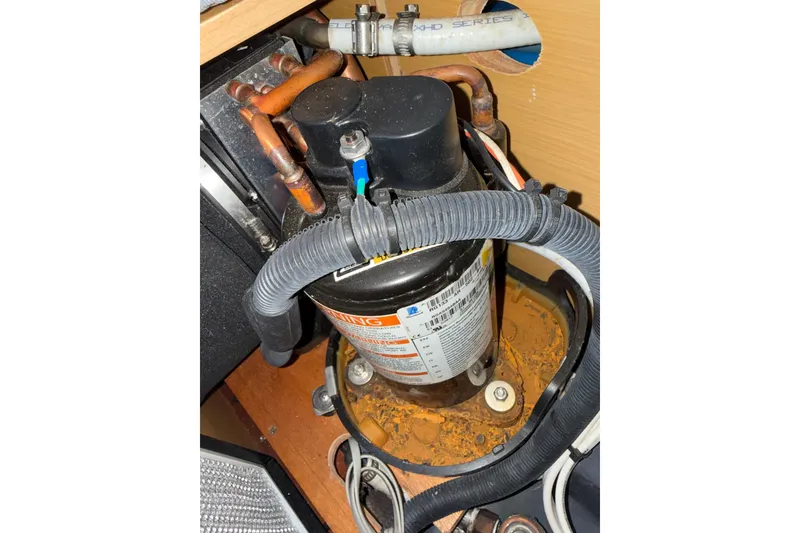 Slide: The Image of Engine compartment of a 2008 Beneteau First 50 sailboat, showing mechanical components. - 15