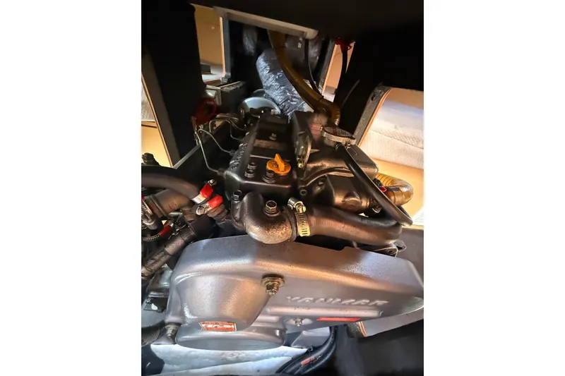 Slide: The Image of Engine of a 2008 Beneteau First 50 sailboat, showcasing mechanical components. - 17