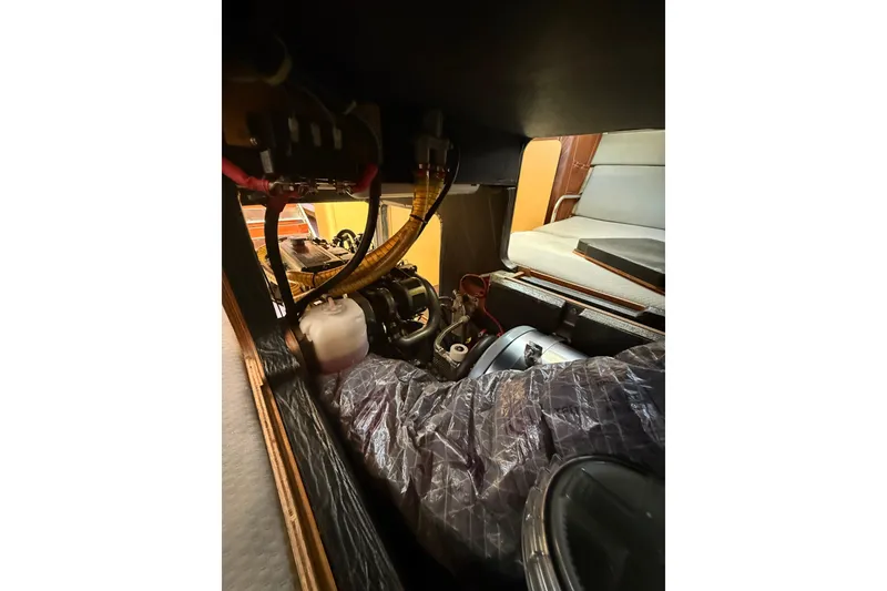 Slide: The Image of Engine compartment of a 2008 Beneteau First 50 sailboat, showcasing mechanical components. - 18