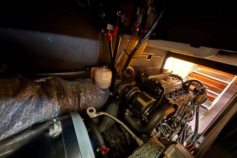 Slide: The Image of Engine room of a 2008 Beneteau First 50 sailboat, showcasing mechanical components. - 20