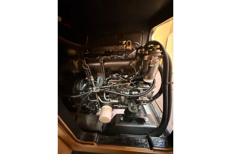 Slide: The Image of Engine compartment of a 2008 Beneteau First 50 sailboat, showcasing intricate mechanical components. - 21