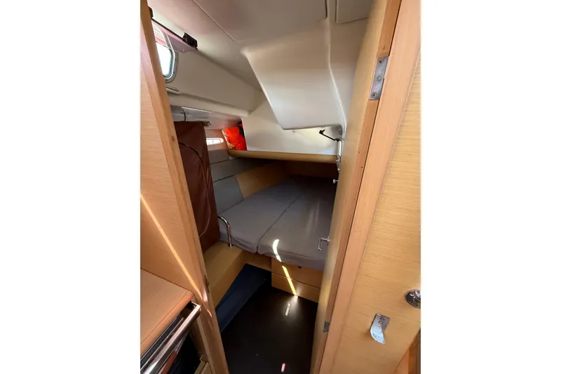 Slide: The Image of Cozy cabin interior of 2008 Beneteau First 50 sailboat with wooden finish. - 24