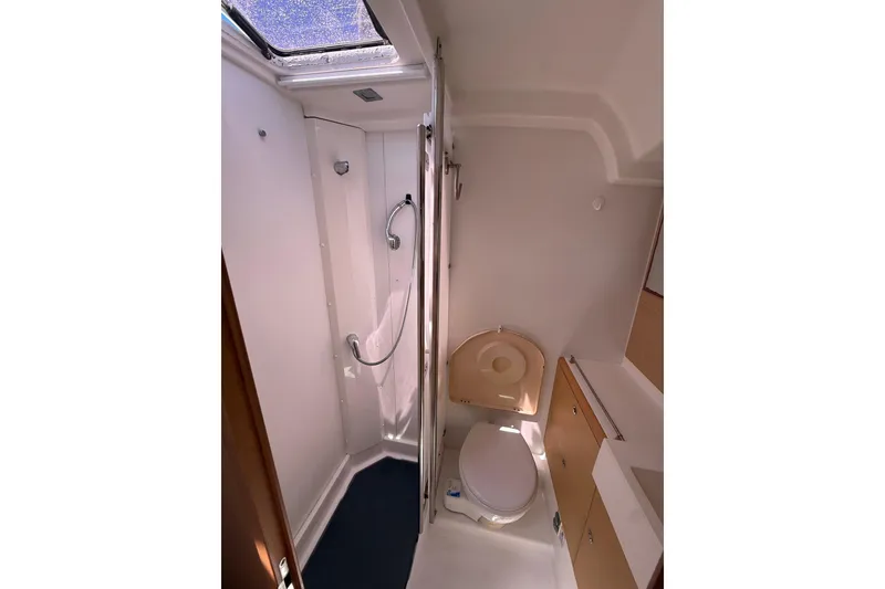 Slide: The Image of Bathroom interior of 2008 Beneteau First 50 yacht, featuring shower and toilet. - 31