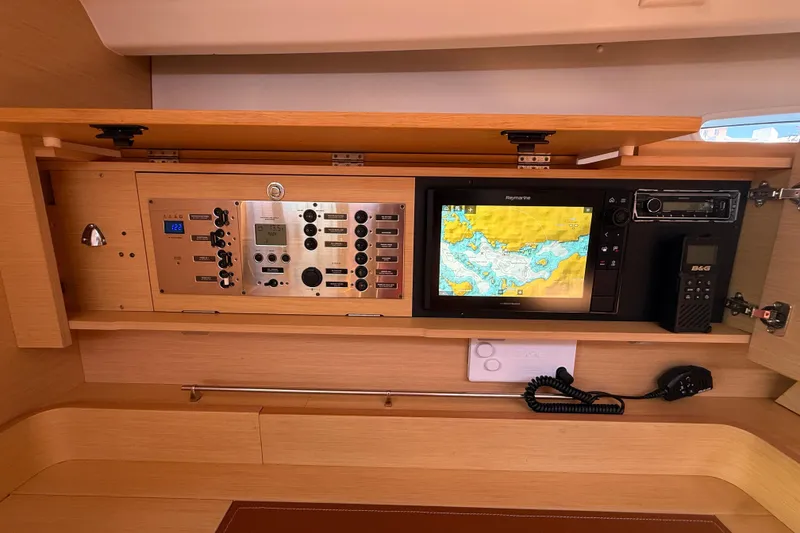 Slide: The Image of Navigation panel of a 2008 Beneteau First 50 yacht with electronic controls and map display. - 35