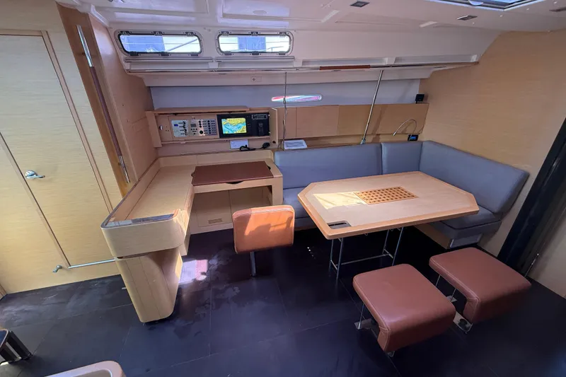 Slide: The Image of Interior of a 2008 Beneteau First 50 yacht with modern seating and navigation equipment. - 36