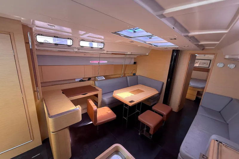 Slide: The Image of Luxurious interior of a 2008 Beneteau First 50 yacht with modern seating and dining area. - 38