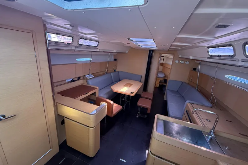 Slide: The Image of Spacious interior of 2008 Beneteau First 50 yacht with modern furnishings and ample seating. - 39