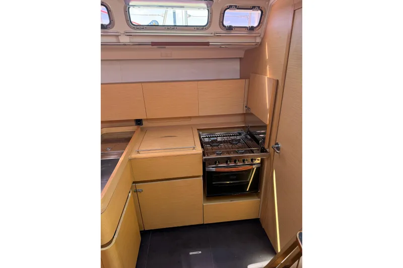 Slide: The Image of Modern kitchen interior of 2008 Beneteau First 50 yacht with stove and cabinetry. - 41