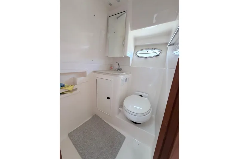 Slide: The Image of Tiara Yachts 3500 Open 2001 bathroom with toilet and sink. - 12